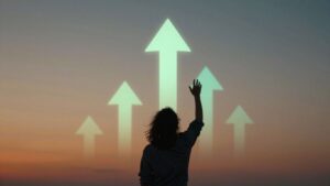 Person reaching up towards success with glowing elements.